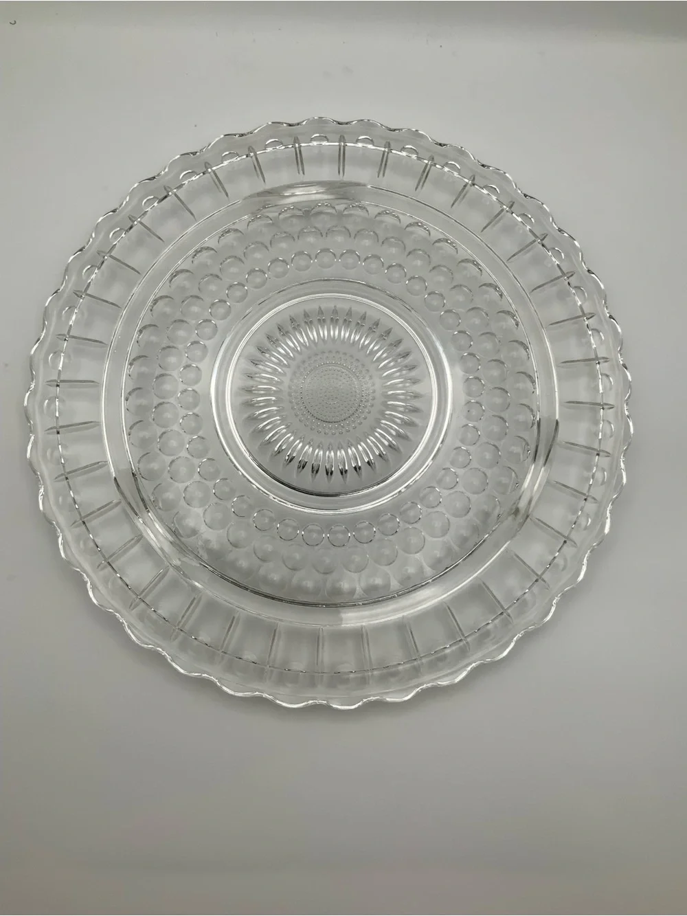 Vintage cake plate by federal glass features a distinctive 